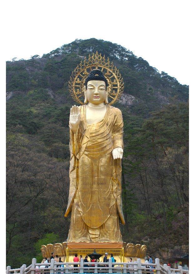 Foto statue i gull av maitreya